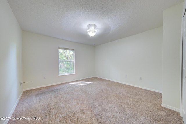 6065 Balboa St, Cocoa, FL 32927 - spare room featuring a textured ceiling and carpet flooring