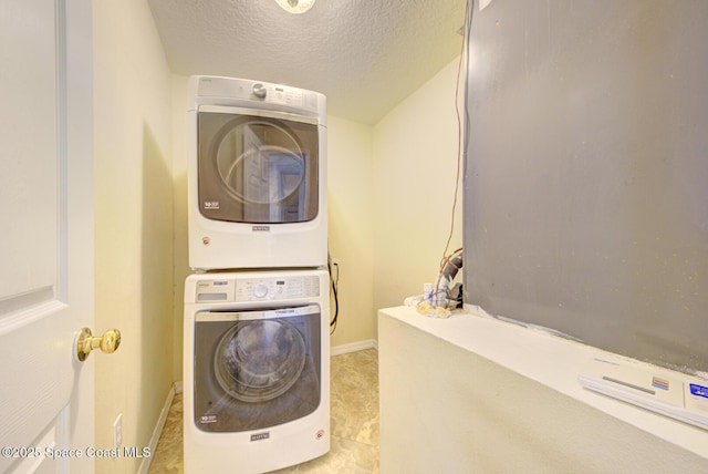 6065 Balboa St, Cocoa, FL 32927 - washroom featuring stacked washer / drying machine and a textured ceiling