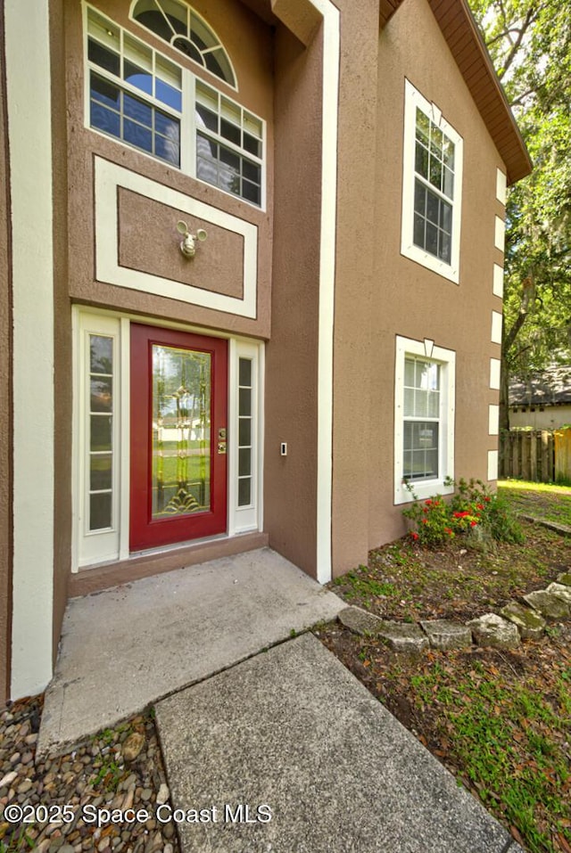 6065 Balboa St, Cocoa, FL 32927 - entrance to property featuring stucco siding