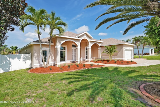 401 Stonehenge Cir, Rockledge, FL 32955 - view of front of home featuring stucco siding, a garage, and driveway