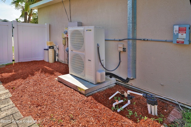 401 Stonehenge Cir, Rockledge, FL 32955 - exterior view of stucco siding and a gate