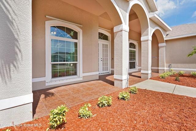 401 Stonehenge Cir, Rockledge, FL 32955 - property entrance featuring stucco siding and a porch