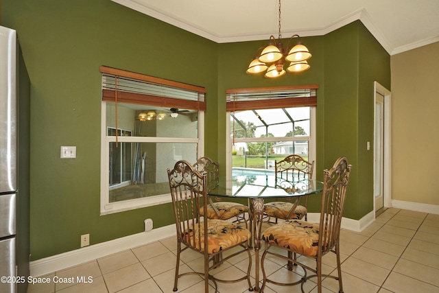 401 Stonehenge Cir, Rockledge, FL 32955 - tiled dining space featuring a chandelier and crown molding