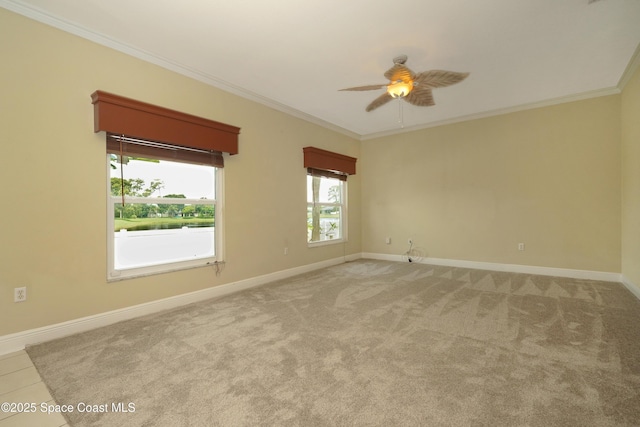 401 Stonehenge Cir, Rockledge, FL 32955 - empty room with crown molding, a ceiling fan, and carpet
