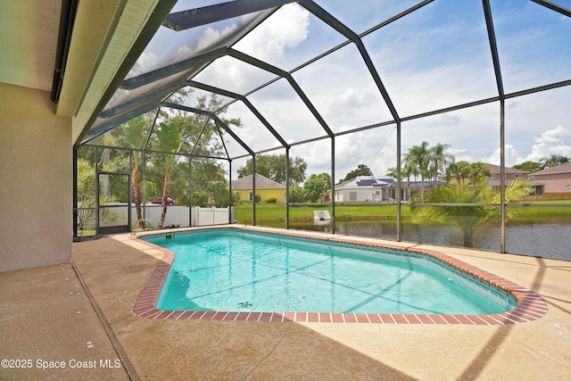 401 Stonehenge Cir, Rockledge, FL 32955 - outdoor pool featuring a water view, a patio, and glass enclosure