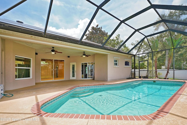 401 Stonehenge Cir, Rockledge, FL 32955 - swimming pool featuring a ceiling fan, a patio area, and glass enclosure