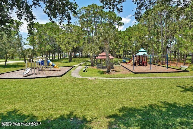 401 Stonehenge Cir, Rockledge, FL 32955 - communal playground featuring a lawn