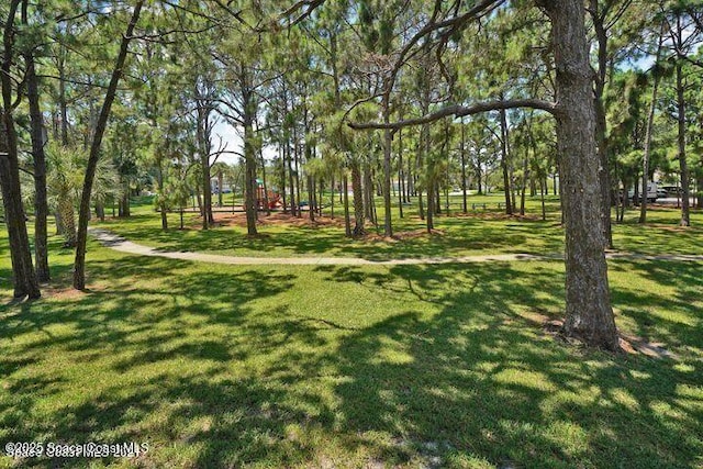 401 Stonehenge Cir, Rockledge, FL 32955 - surrounding community with a yard