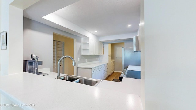 3799 S Banana River Blvd Unit 1025, Cocoa Beach, FL 32931 - kitchen featuring open shelves, white cabinets, light countertops, recessed lighting, and light wood finished floors