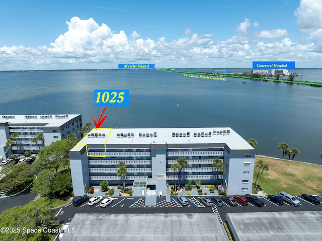 3799 S Banana River Blvd Unit 1025, Cocoa Beach, FL 32931 - bird's eye view of apartment complex and a nearby body of water