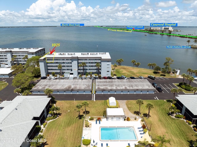 3799 S Banana River Blvd Unit 1025, Cocoa Beach, FL 32931 - bird's eye view of a large body of water and a pool area