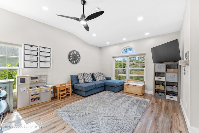 1218 Rolling Meadows Dr, Rockledge, FL 32955 - living room with a ceiling fan, light wood finished floors, recessed lighting, and lofted ceiling