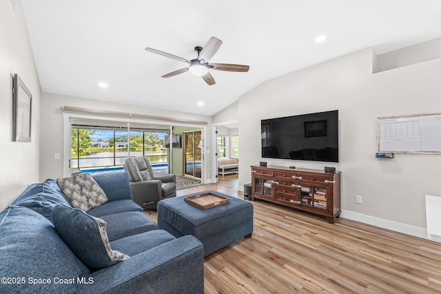 1218 Rolling Meadows Dr, Rockledge, FL 32955 - living area featuring lofted ceiling, light wood-style flooring, ceiling fan, and recessed lighting