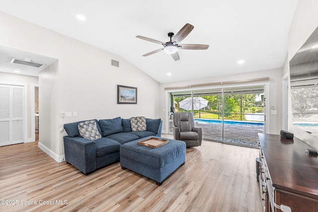 1218 Rolling Meadows Dr, Rockledge, FL 32955 - living room with ceiling fan, light wood finished floors, lofted ceiling, and recessed lighting