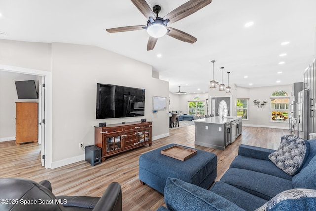 1218 Rolling Meadows Dr, Rockledge, FL 32955 - living room featuring light wood-type flooring, a ceiling fan, and recessed lighting