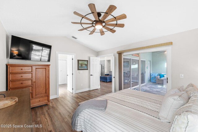 1218 Rolling Meadows Dr, Rockledge, FL 32955 - bedroom with wood finished floors, vaulted ceiling, and a ceiling fan
