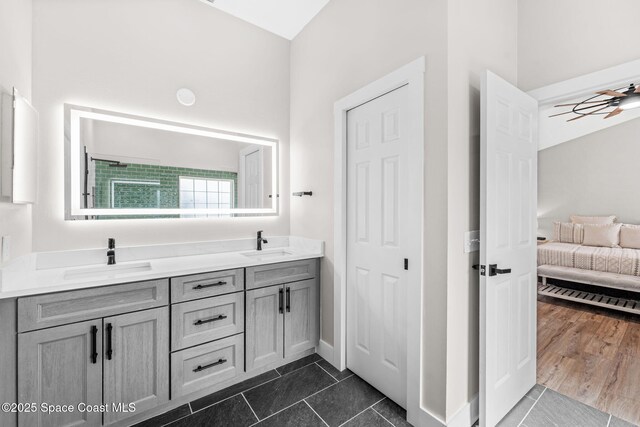 1218 Rolling Meadows Dr, Rockledge, FL 32955 - ensuite bathroom featuring double vanity and tile patterned flooring