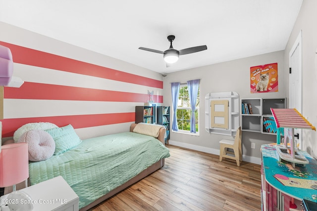 1218 Rolling Meadows Dr, Rockledge, FL 32955 - bedroom with wood finished floors and ceiling fan