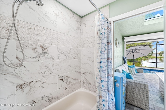 1218 Rolling Meadows Dr, Rockledge, FL 32955 - bathroom featuring shower / tub combo and a water view