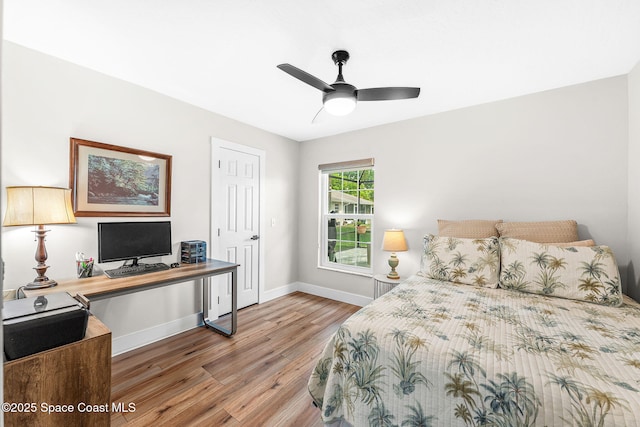 1218 Rolling Meadows Dr, Rockledge, FL 32955 - bedroom with light wood-type flooring, a desk, and ceiling fan