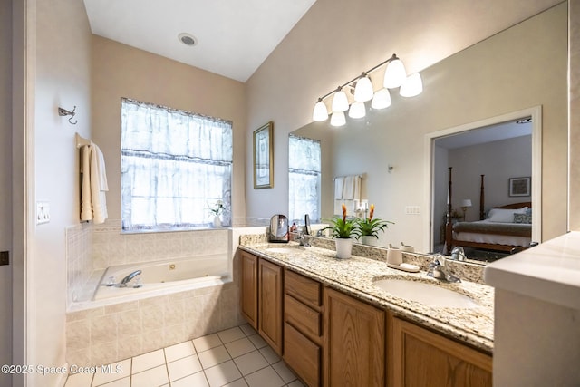 4595 Alan Shepard Ave, Cocoa, FL 32926 - ensuite bathroom with double vanity, a tub with jets, and tile patterned floors