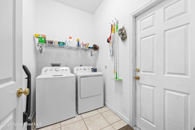 4595 Alan Shepard Ave, Cocoa, FL 32926 - laundry area with independent washer and dryer and light tile patterned flooring