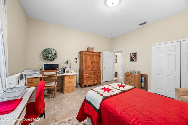 4595 Alan Shepard Ave, Cocoa, FL 32926 - bedroom with an office area, light tile patterned floors, and a closet
