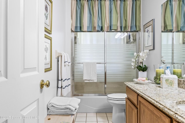 4595 Alan Shepard Ave, Cocoa, FL 32926 - full bathroom featuring vanity, tile patterned floors, and bath / shower combo with glass door