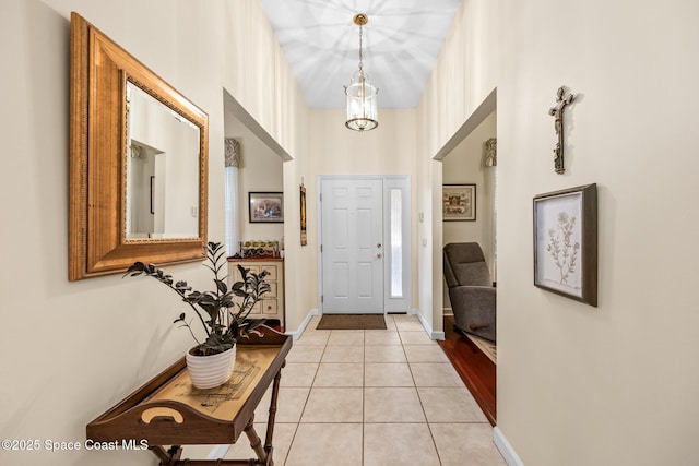 4595 Alan Shepard Ave, Cocoa, FL 32926 - entryway featuring light tile patterned floors and baseboards