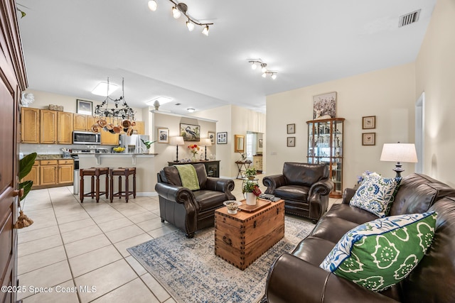 4595 Alan Shepard Ave, Cocoa, FL 32926 - living area featuring light tile patterned floors