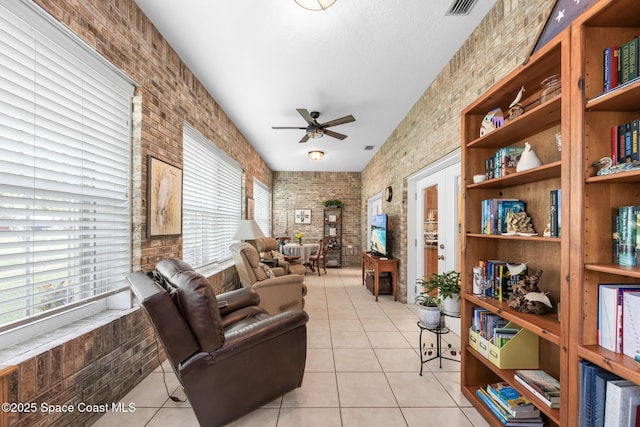 4595 Alan Shepard Ave, Cocoa, FL 32926 - sitting room with light tile patterned flooring and ceiling fan