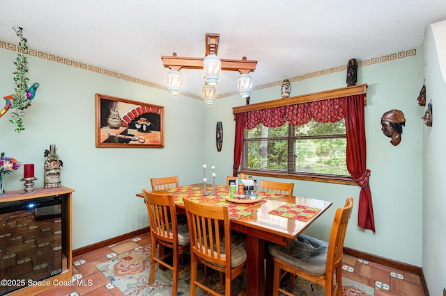 3717 SW Bayfield St, Cocoa, FL 32926 - dining room with beverage cooler and baseboards