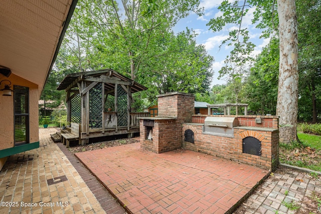 3717 SW Bayfield St, Cocoa, FL 32926 - view of patio with an outdoor kitchen and a gazebo