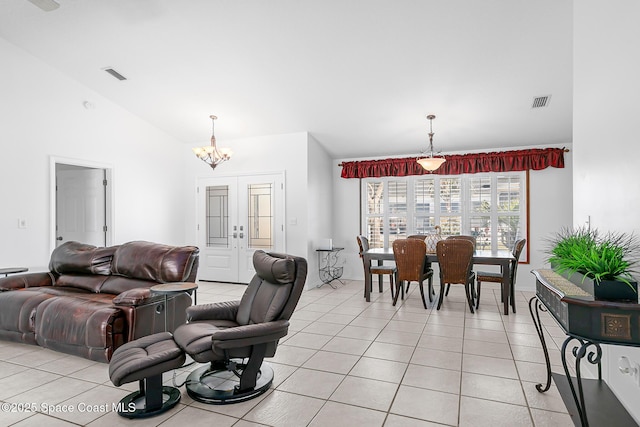 100 Matthews St, Satellite Beach, FL 32937 - living room with a chandelier, light tile patterned flooring, and lofted ceiling