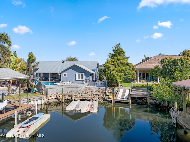 100 Matthews St, Satellite Beach, FL 32937 - dock area featuring a water view and boat lift