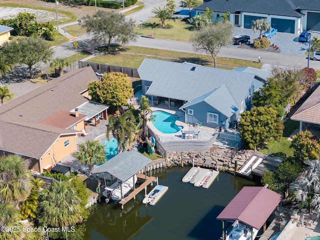 100 Matthews St, Satellite Beach, FL 32937 - aerial perspective of suburban area with a pool and a nearby body of water
