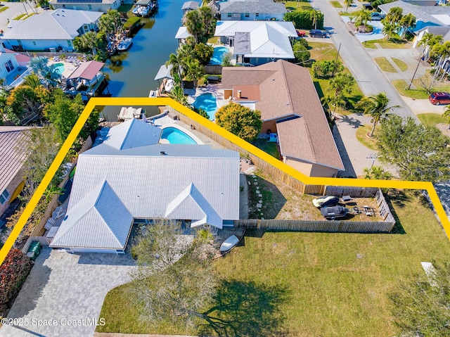 100 Matthews St, Satellite Beach, FL 32937 - aerial view of residential area with property parcel outlined and a nearby body of water