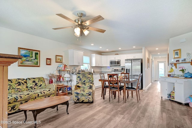1689 Colorado St SE, Palm Bay, FL 32909 - living room featuring light wood-type flooring, a ceiling fan, plenty of natural light, and recessed lighting