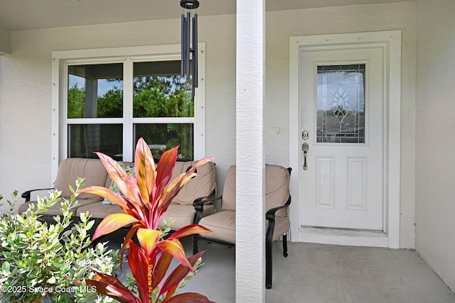 1689 Colorado St SE, Palm Bay, FL 32909 - entrance to property with stucco siding and covered porch