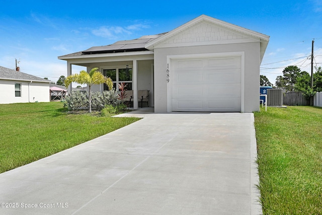 1689 Colorado St SE, Palm Bay, FL 32909 - ranch-style home with concrete driveway, roof mounted solar panels, an attached garage, stucco siding, and covered porch