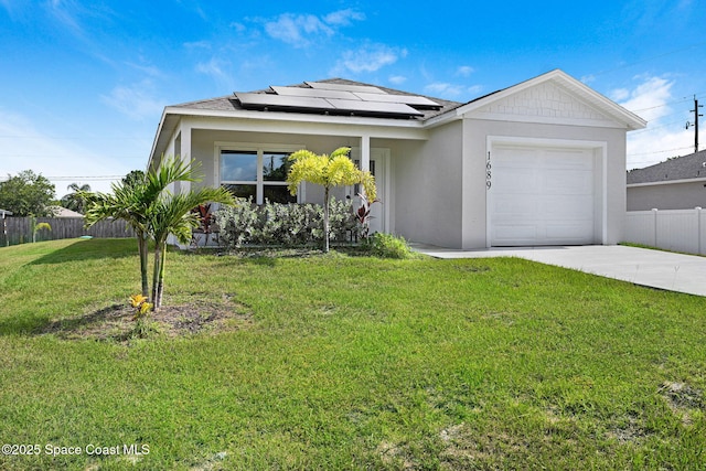 1689 Colorado St SE, Palm Bay, FL 32909 - view of front of home featuring driveway, an attached garage, solar panels, and stucco siding