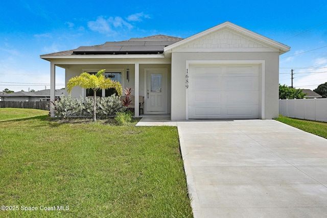 1689 Colorado St SE, Palm Bay, FL 32909 - view of front facade with roof mounted solar panels, concrete driveway, an attached garage, stucco siding, and covered porch