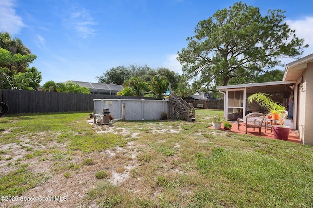 6640 Dock Ave, Cocoa, FL 32927 - fenced backyard featuring a sunroom and stairway