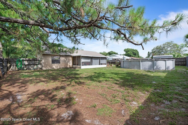 6640 Dock Ave, Cocoa, FL 32927 - fenced backyard with a sunroom
