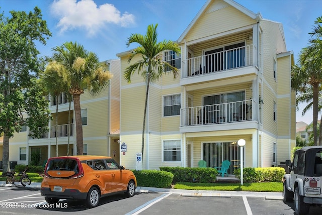 1951 Island Club Dr Unit 3-48, Melbourne, FL 32903 - view of building exterior with uncovered parking