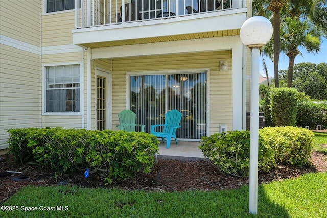 1951 Island Club Dr Unit 3-48, Melbourne, FL 32903 - view of exterior entry featuring a balcony