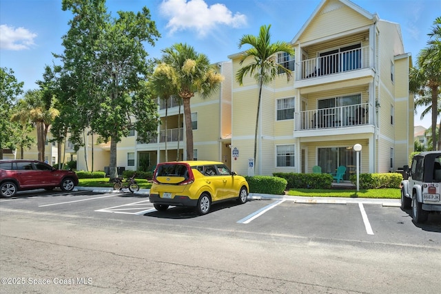 1951 Island Club Dr Unit 3-48, Melbourne, FL 32903 - view of building exterior featuring uncovered parking