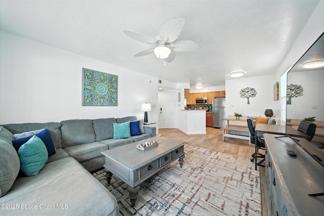 1951 Island Club Dr Unit 3-48, Melbourne, FL 32903 - living area with a ceiling fan and light wood finished floors