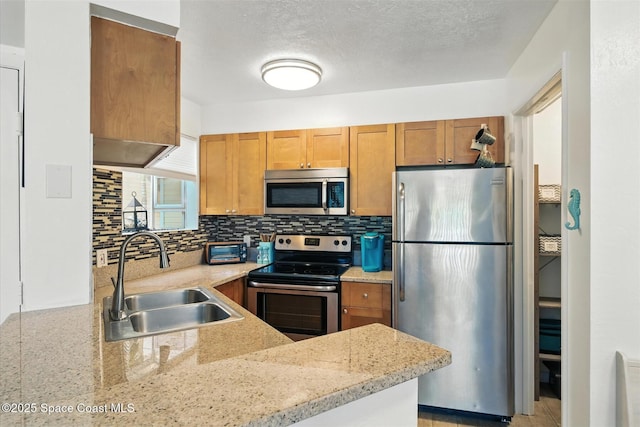 1951 Island Club Dr Unit 3-48, Melbourne, FL 32903 - kitchen with stainless steel appliances, tasteful backsplash, brown cabinets, and light stone countertops