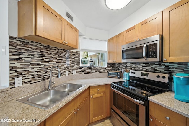 1951 Island Club Dr Unit 3-48, Melbourne, FL 32903 - kitchen with appliances with stainless steel finishes, light countertops, and decorative backsplash